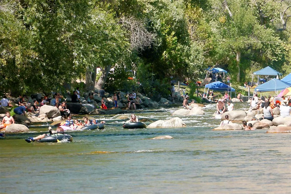 Visitors enjoying a low water section of Riverside Park